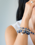Stack of blue beaded bracelets in blue sodalite and sterling silver