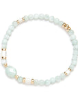 Green Angelite Beaded bracelet with gold accents on a white background