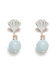 Pair of earrings with shell-shaped tops and light blue beads on a white background