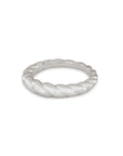 Silver ring with a textured design on a white background