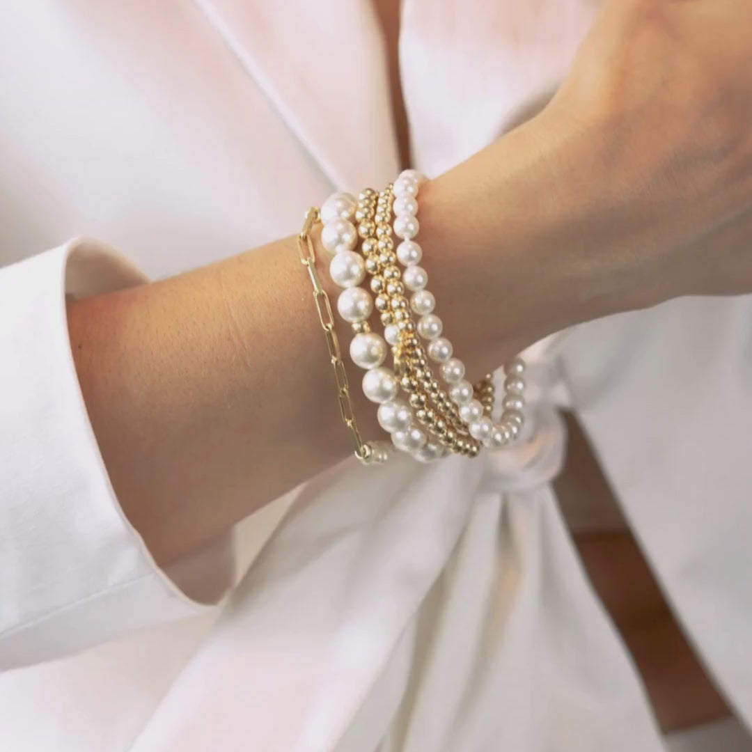 A_white_Stacking_Bracelet_-_Signature_Set_Our_Essential_in_Pearl
