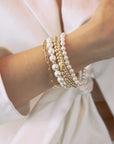 A_white_Stacking_Bracelet_-_Signature_Set_Our_Essential_in_Pearl