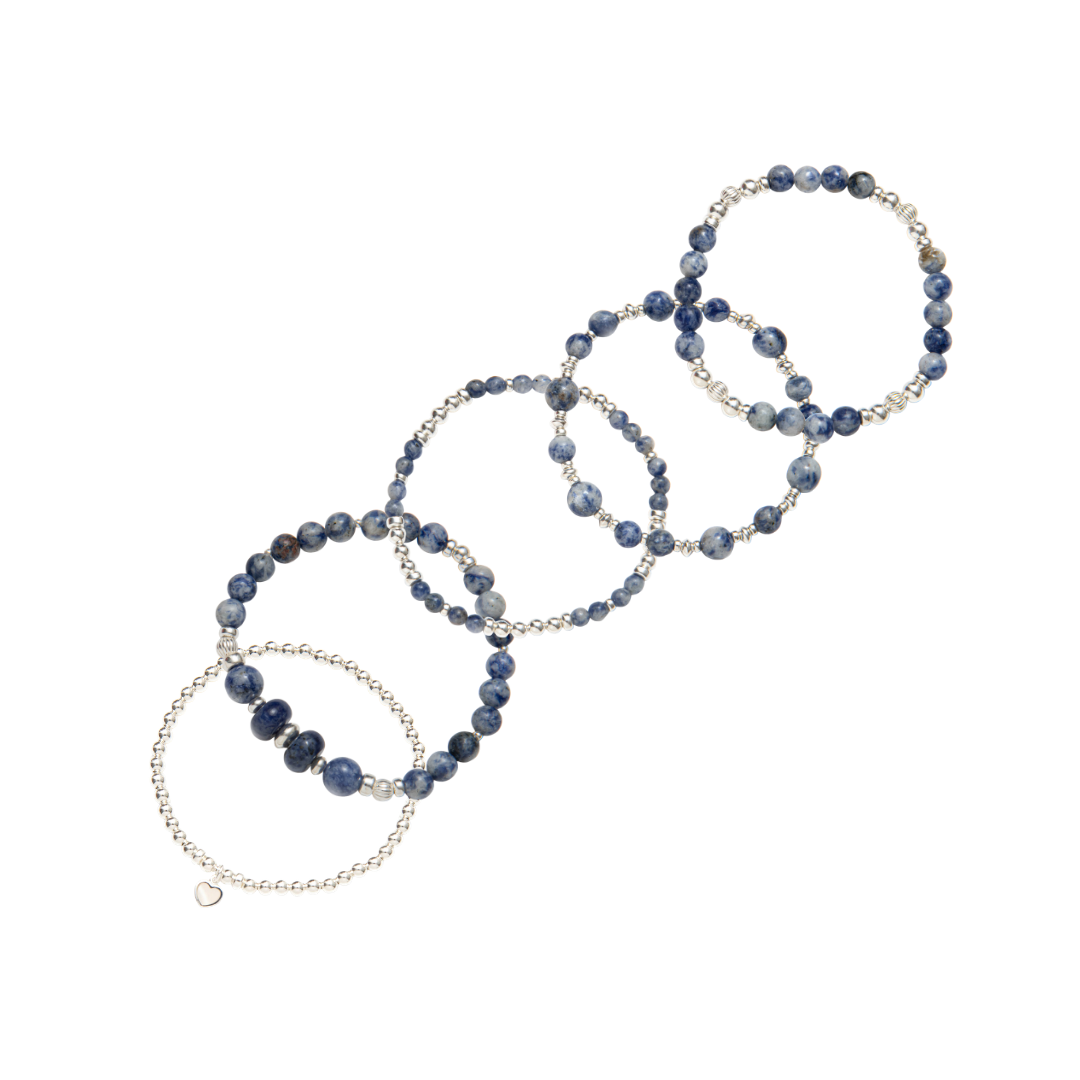 Stack of blue beaded bracelets in blue sodalite and sterling silver, with a heart charm / Beblue Bijoux