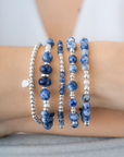 Stack of blue beaded bracelets in blue sodalite and sterling silver, with a heart charm / Beblue Bijoux