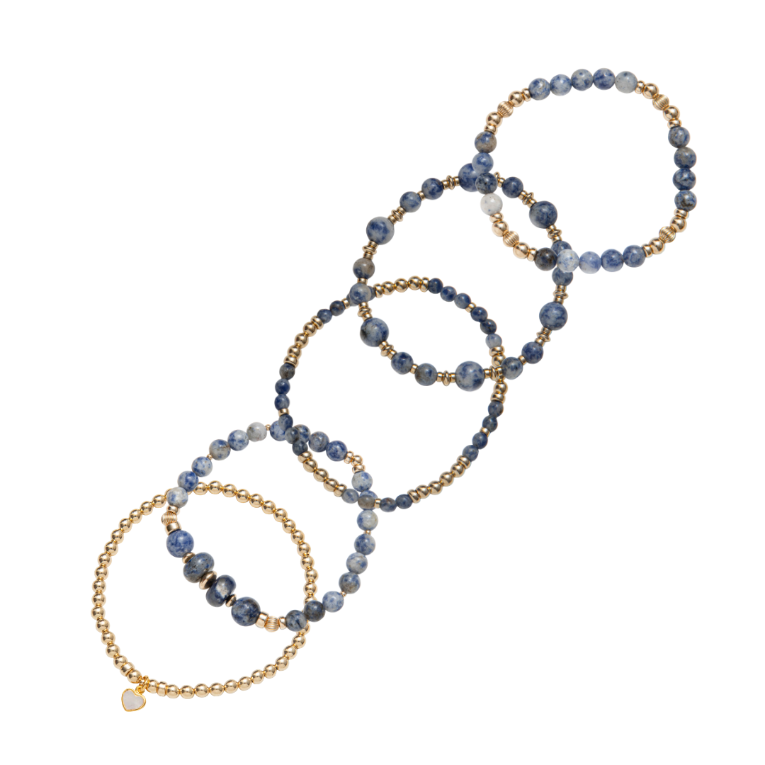 Stack of blue beaded bracelets in blue sodalite and 14kt gold vermeil, with a heart charm / Beblue Bijoux