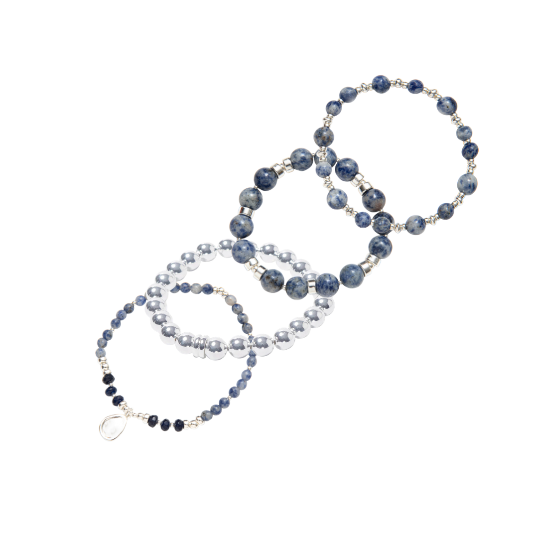 Stack of blue beaded bracelets in blue sodalite and sterling silver