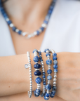 Stack of blue beaded bracelets in blue sodalite and sterling silver, with a heart charm / Beblue Bijoux