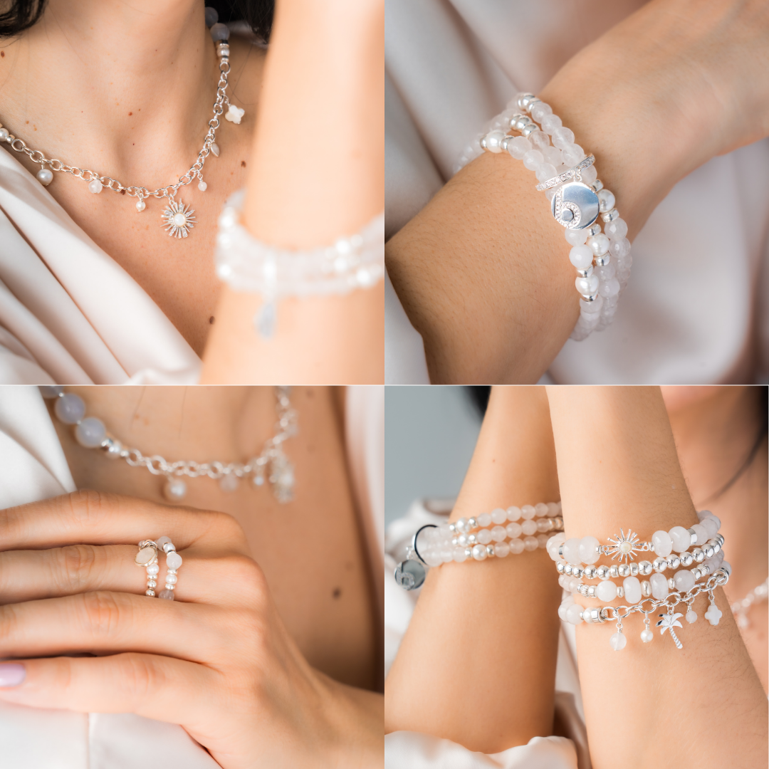 signature set of jewelry including necklaces, bracelets, and rings. white 