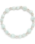 Light blue and green beaded bracelet on a white background