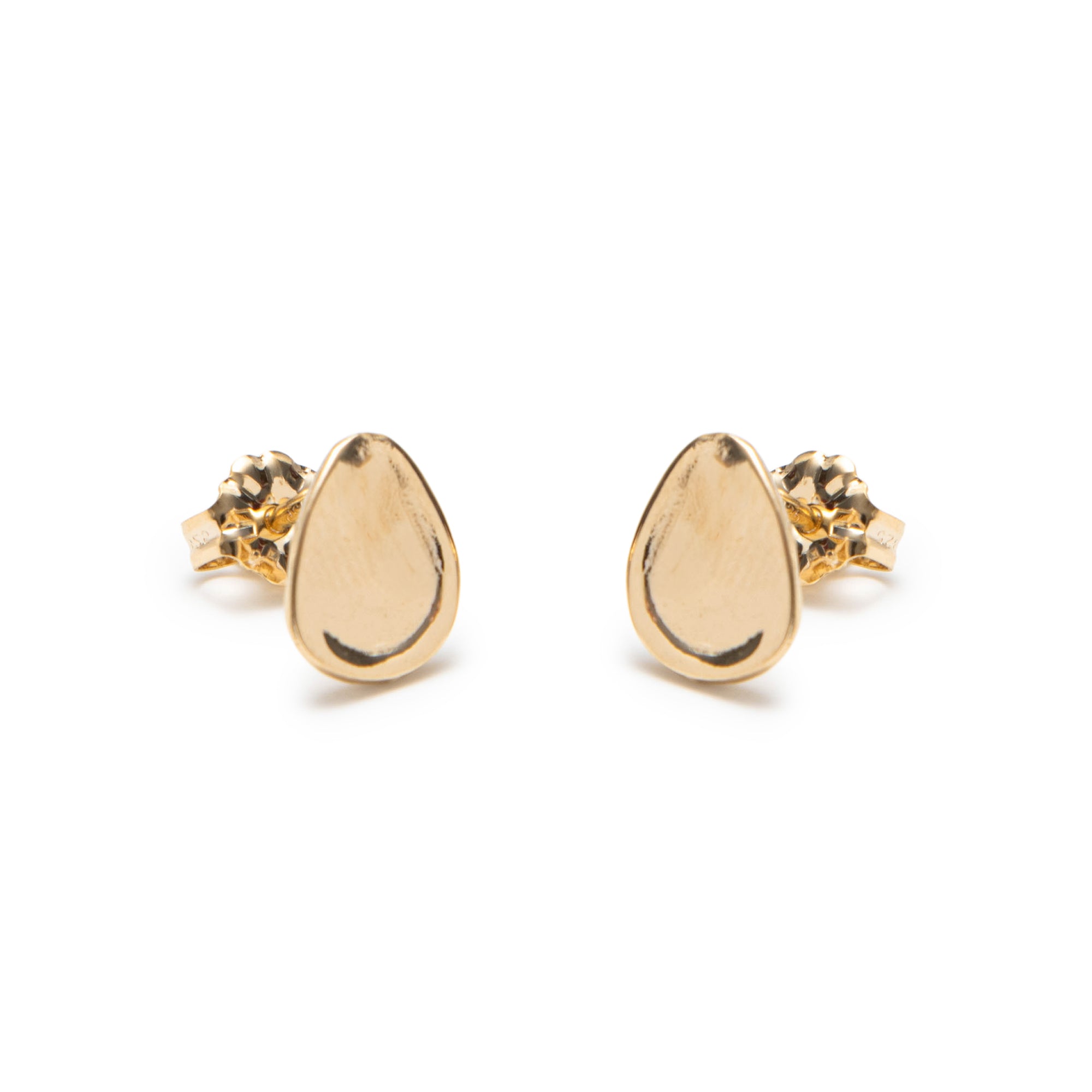 Gold teardrop earrings on a white background