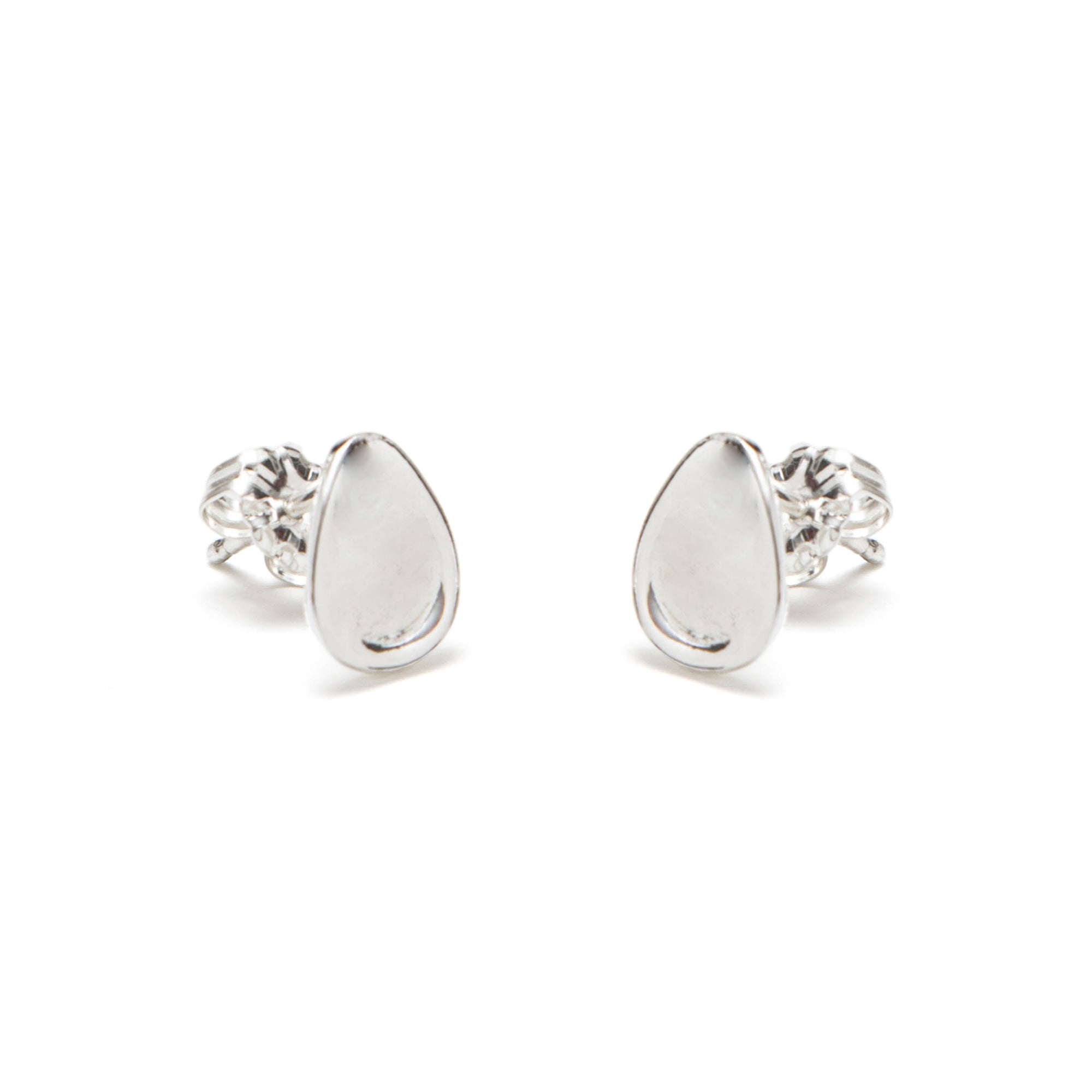 Pair of silver teardrop earrings on a white background