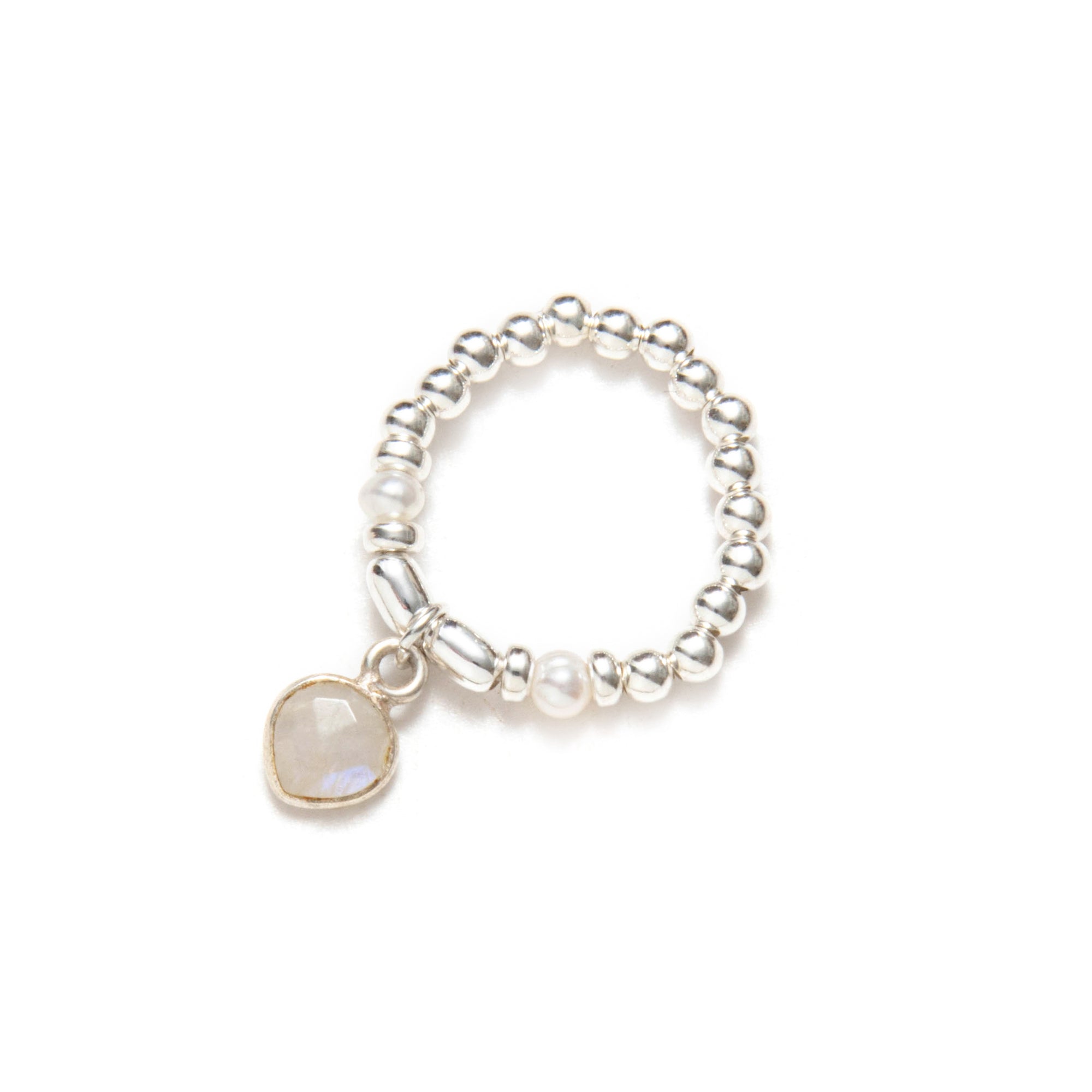 Pearl elastic ring with a central stone on a white background