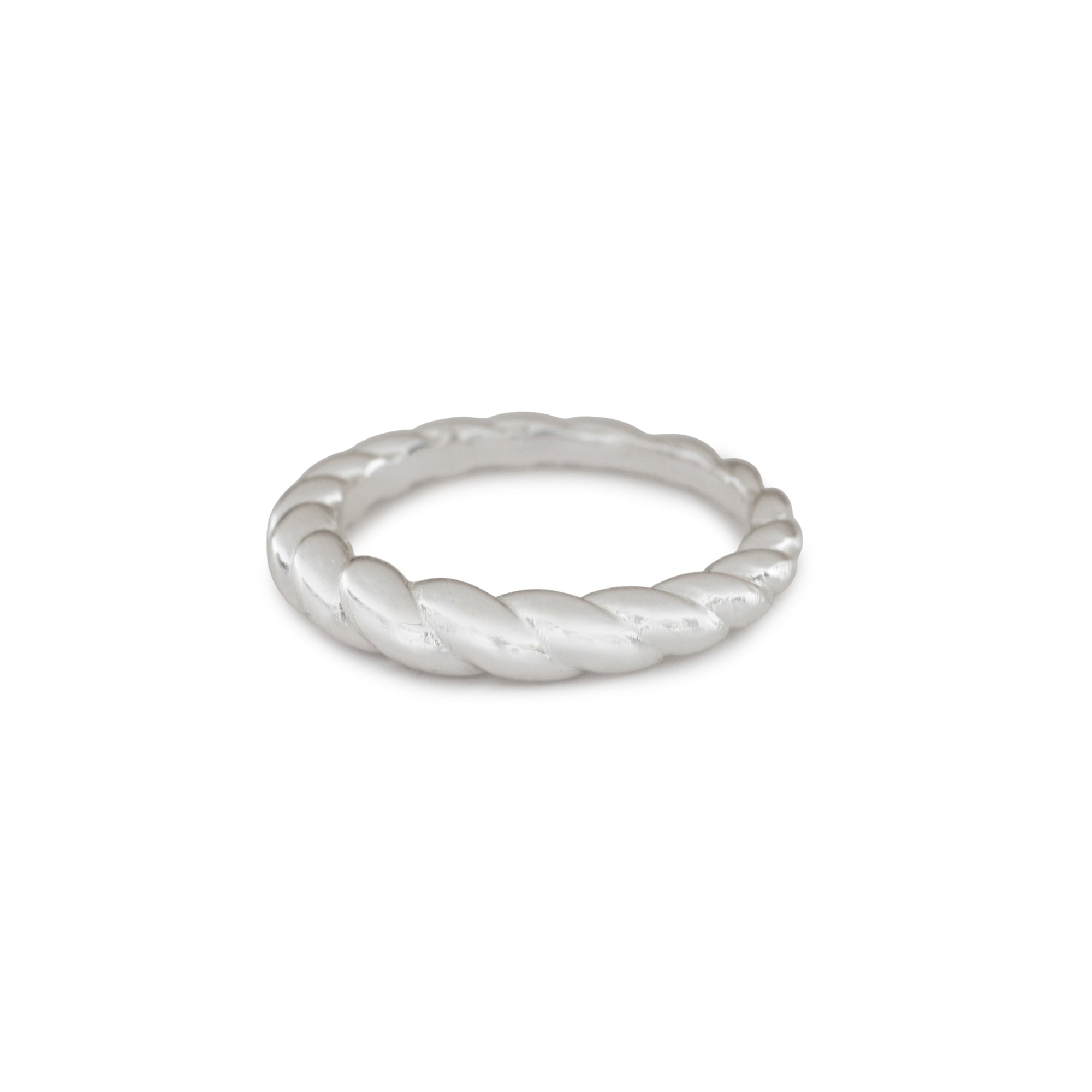 Silver ring with a textured design on a white background