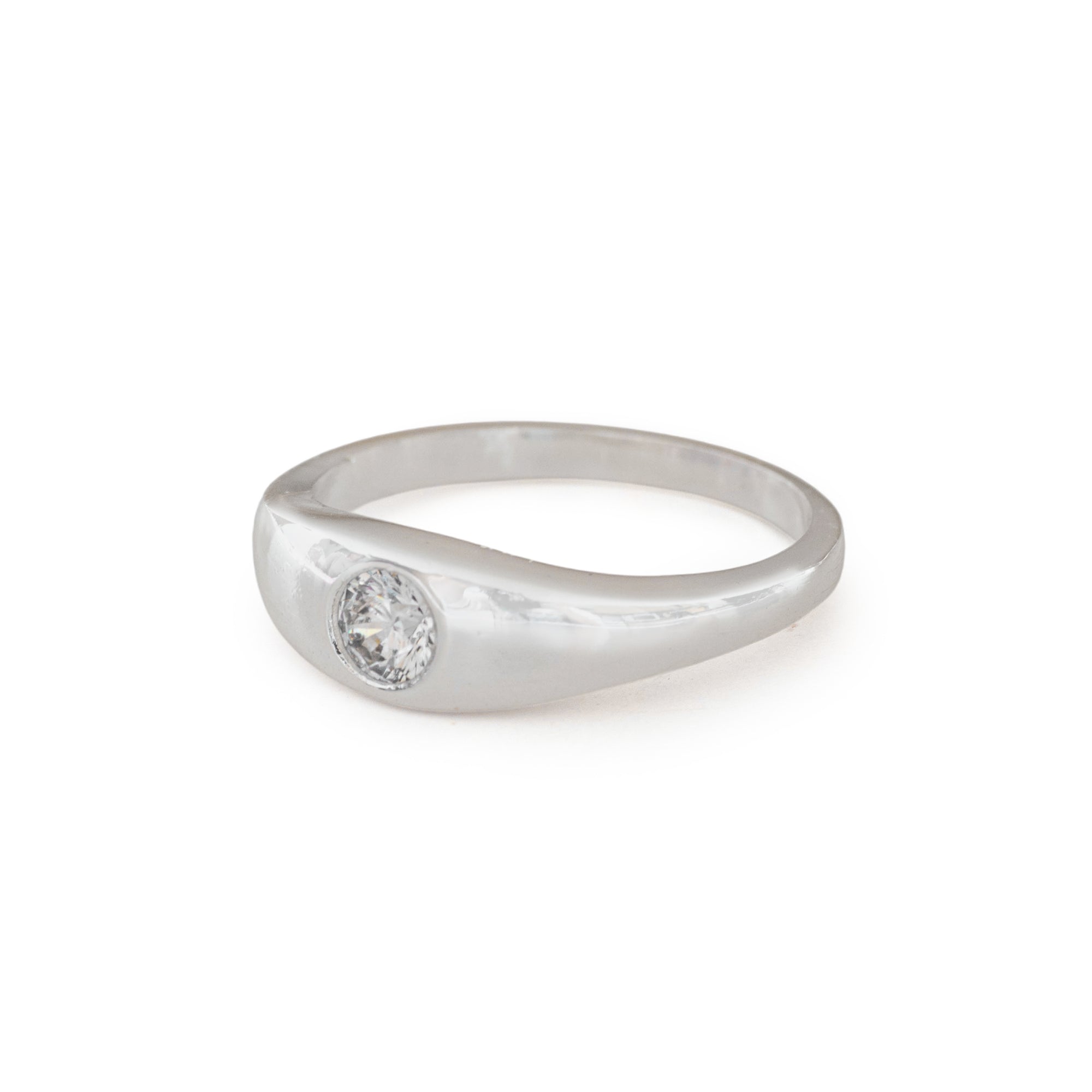 Silver ring with a diamond on a white background