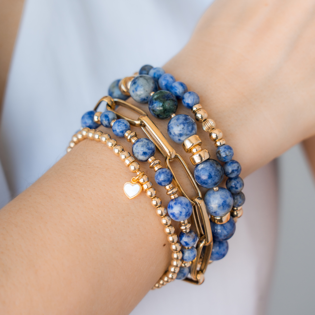 Stack of blue beaded bracelets in blue sodalite and gold vermeil, with a heart charm / Beblue Bijoux