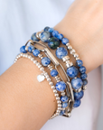 Stack of blue beaded bracelets in blue sodalite and silver with a heart charm / Beblue Bijoux