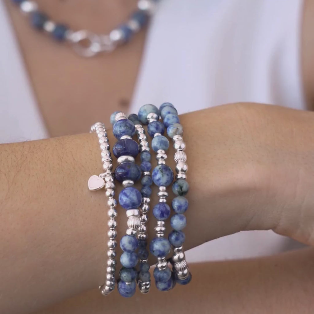 Stack of blue beaded bracelets in blue sodalite and sterling silver, with a heart charm / Beblue Bijoux