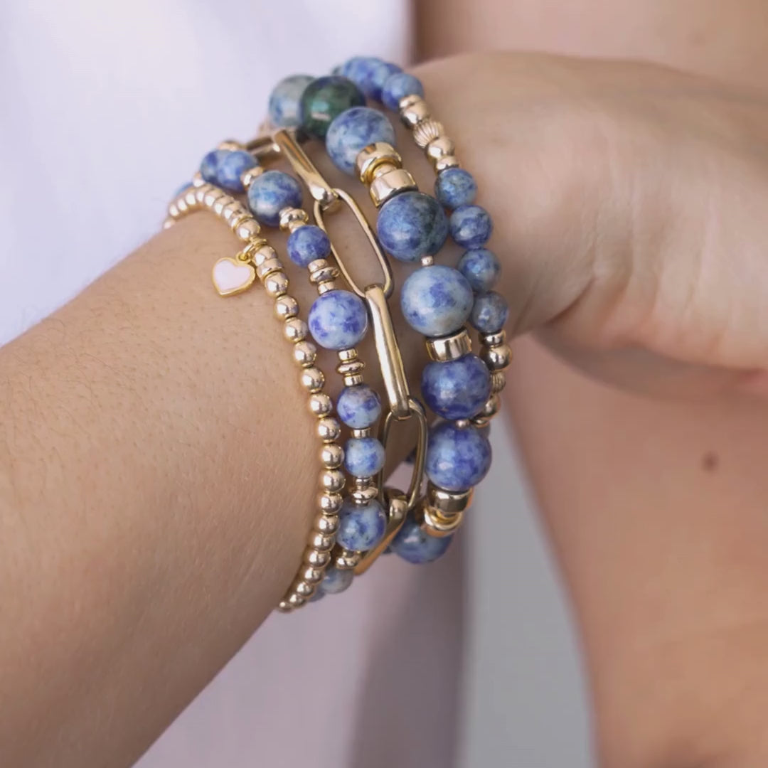Stack of blue beaded bracelets in blue sodalite and gold vermeil, with a heart charm / Beblue Bijoux