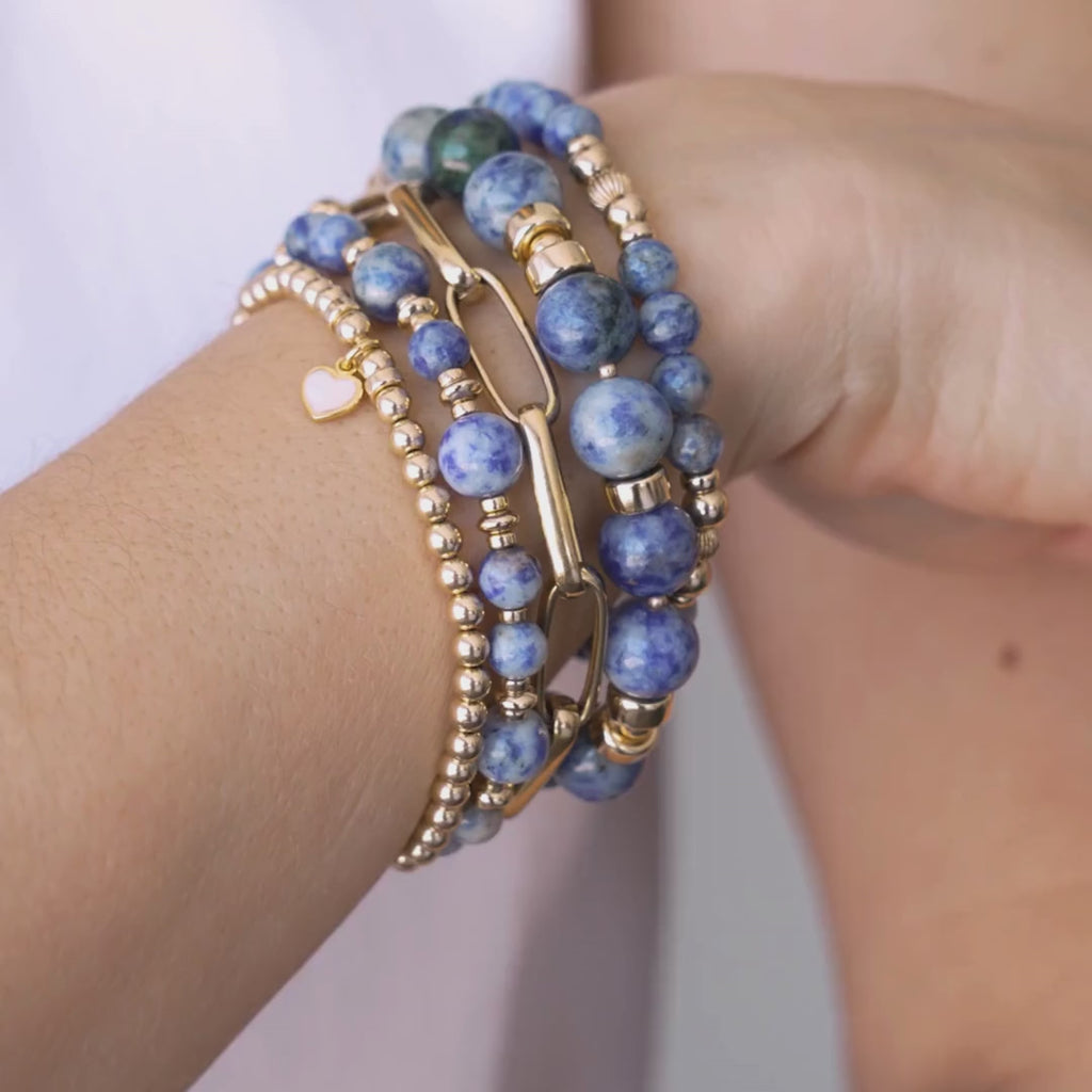 Stack of blue beaded bracelets in blue sodalite and gold vermeil, with a heart charm / Beblue Bijoux
