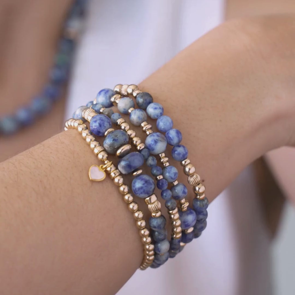 Stack of blue beaded bracelets in blue sodalite and gold vermeil, with a heart charm / Beblue Bijoux